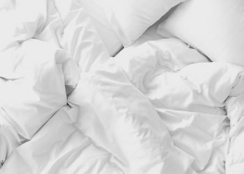 white bed with a mattress