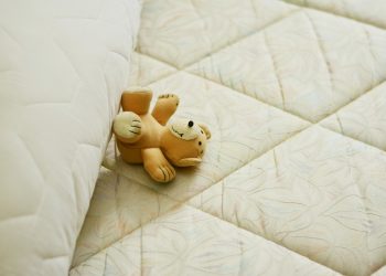 mattress with teddy bear on it