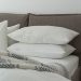 white pillows on a bed